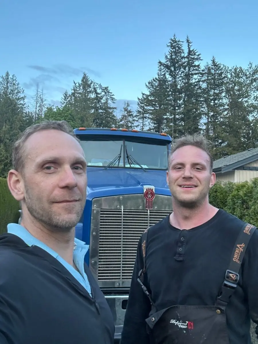Proseptix team members in front of their septic pump truck