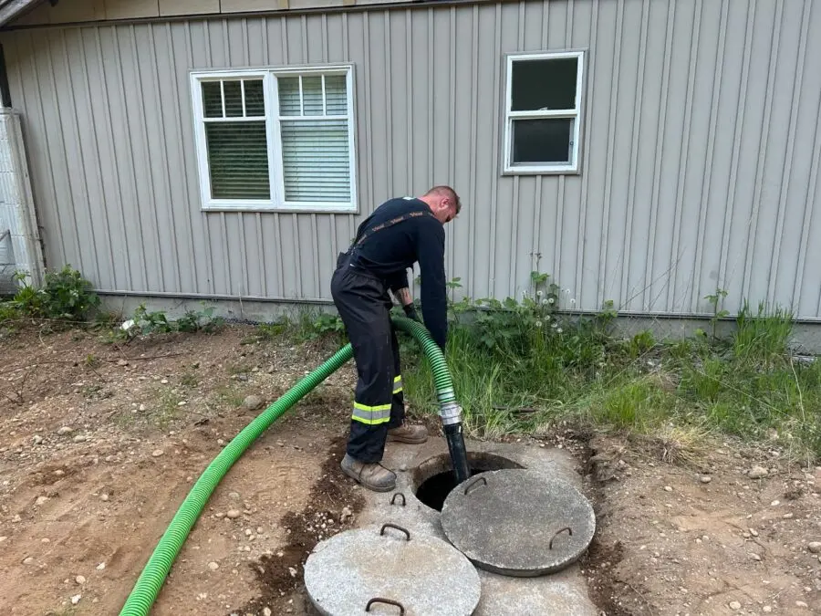 Proseptix technician pumping out a residential septic tank